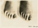 Image of Foot of a child and that of a woman